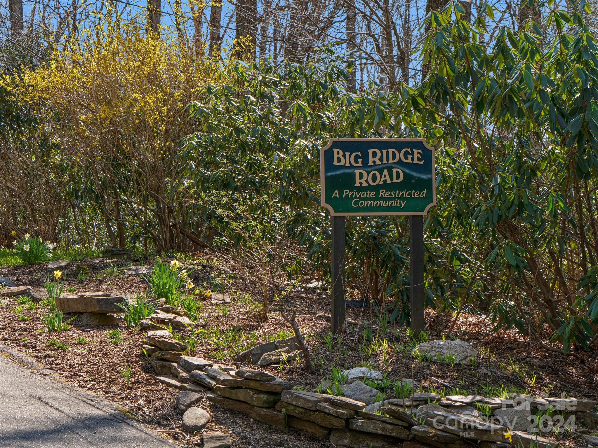 0 Big Ridge Road, Unit 62 & 63 Burnsville, NC 28714 - Photo 30 of 31 a sign that is sitting on a brick wall
