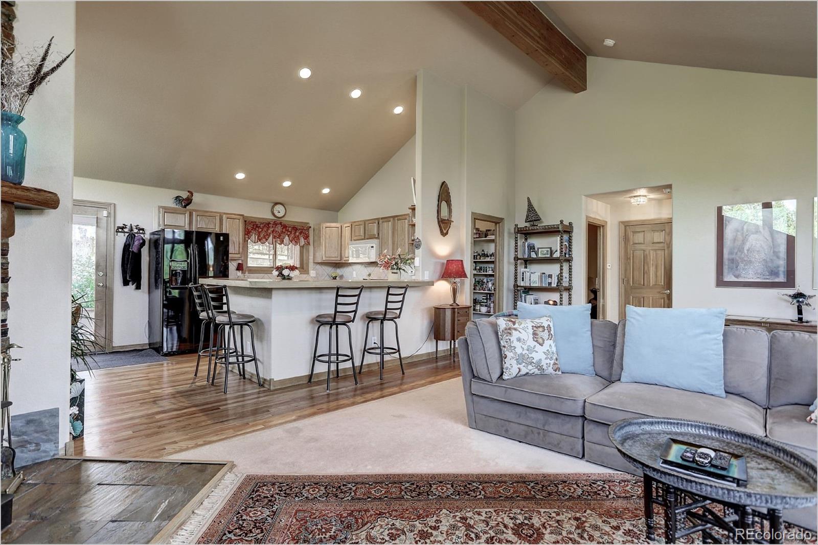 109 Royal Ridge Drive Bailey, CO 80421 - Photo 10 of 39 a living room with furniture and kitchen view