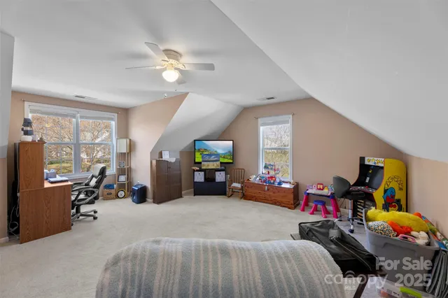 a bedroom with furniture and a gym equipment