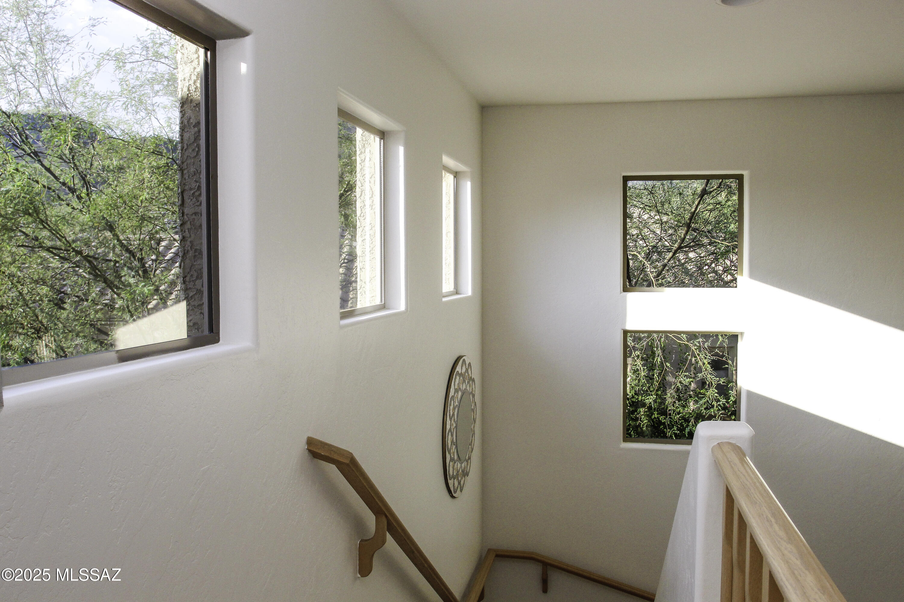 5202 Spring View Drive Tucson, AZ 85749 - Photo 24 of 49 a view of a hallway with furniture and a window