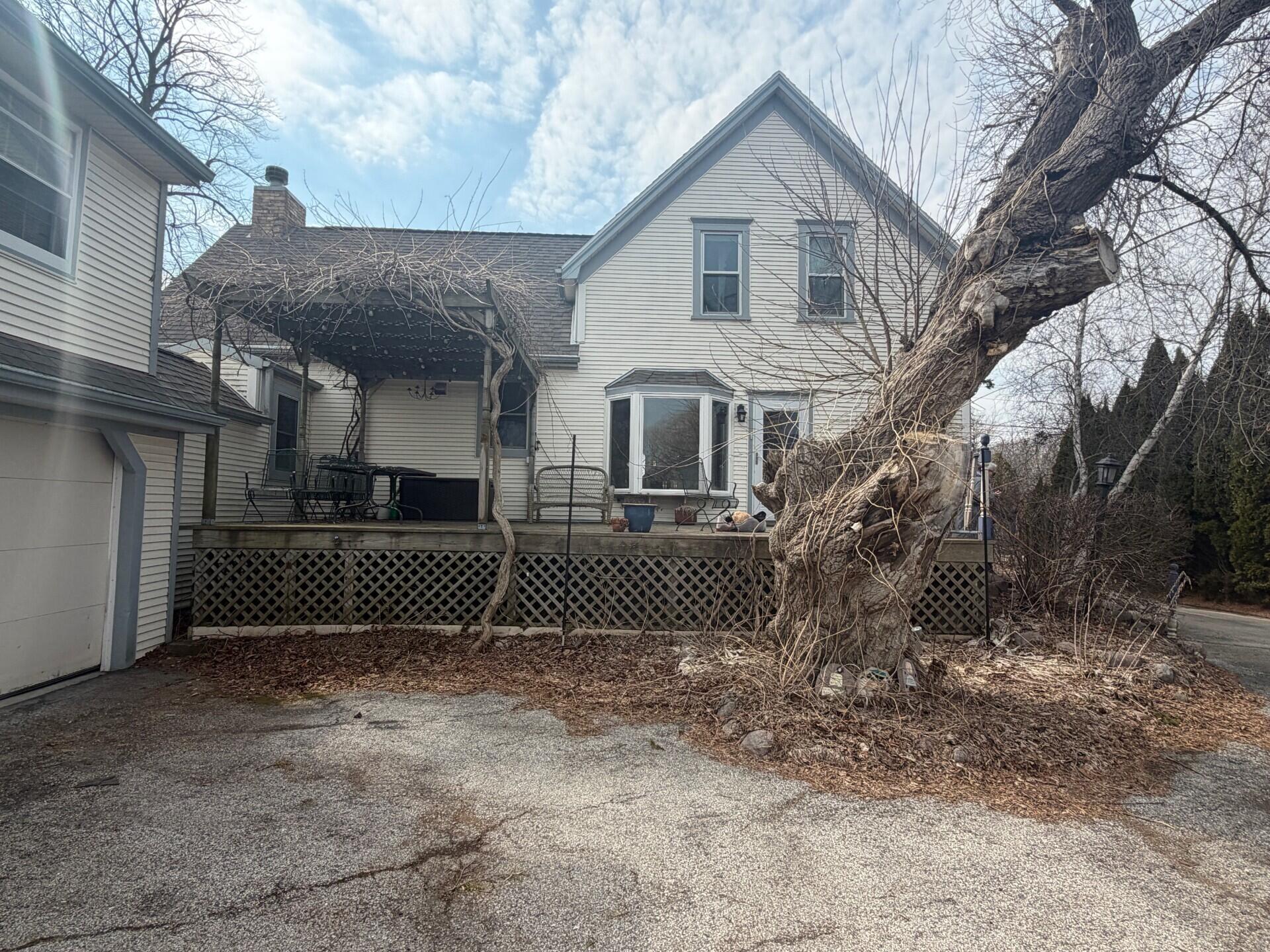 11004 North Range Line Road Mequon, WI 53092 - Photo 5 of 7 BACK OF HOME AND DECK