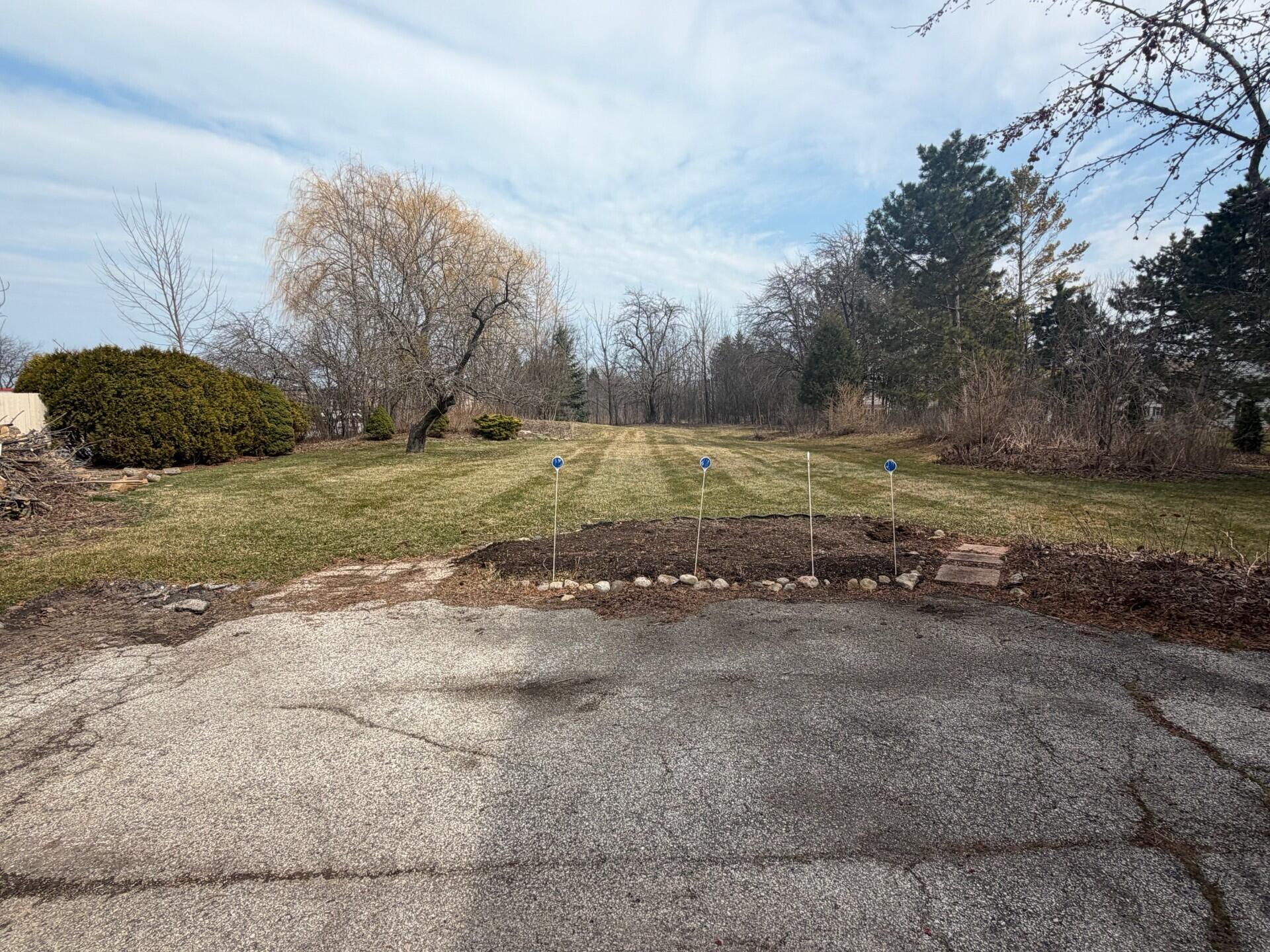 11004 North Range Line Road Mequon, WI 53092 - Photo 7 of 7 BACKYARD AND DRIVEWAY