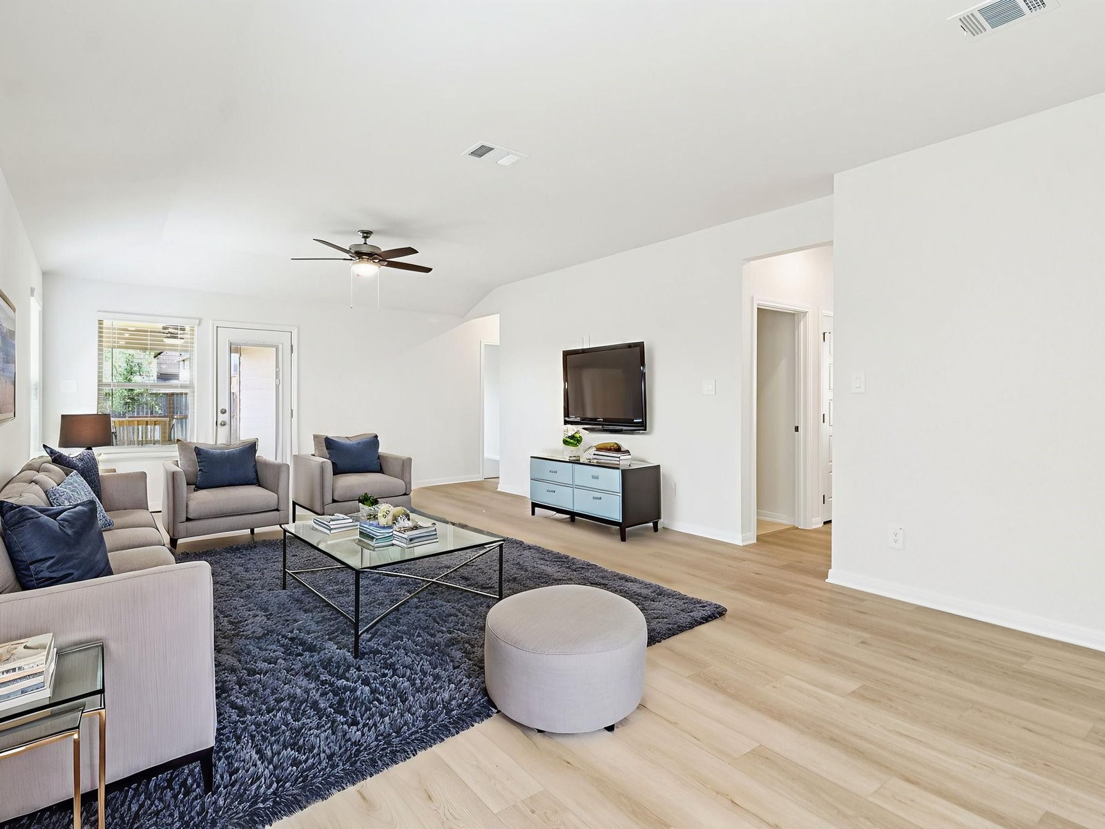 16258 Parish Pointe Court Conroe, TX 77302 - Photo 7 of 10 a living room with furniture and a flat screen tv