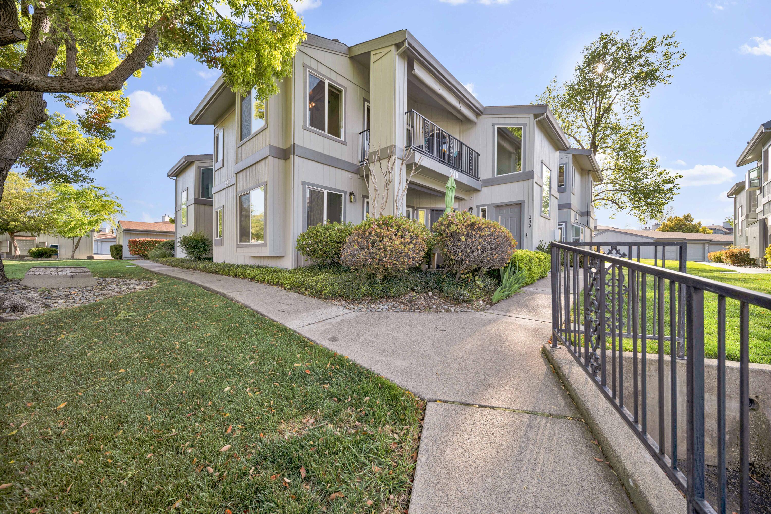 249 Ridgetop Drive, Unit 239 Redding, CA 96003 - Photo 1 of 31 a front view of a house with a garden and pathway