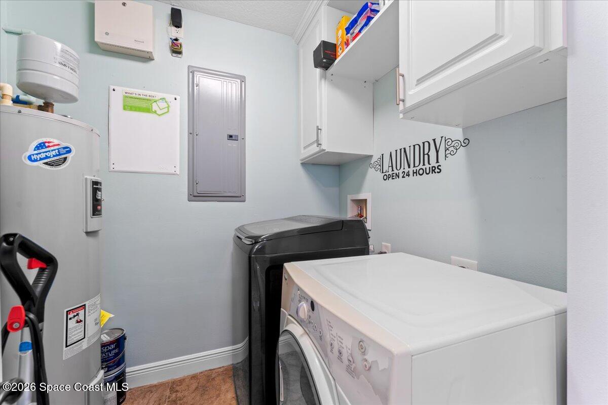 4125 West End Road, Unit 405 Cocoa Beach, FL 32931 - Photo 24 of 44 a utility room with dryer and washer