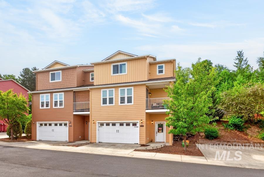 1337 Bristol Road Moscow, ID 83843 - Photo 25 of 28 Contemporary multi-level townhome featuring a two-tone facade, attached garage, and a private balcony with metal railing
