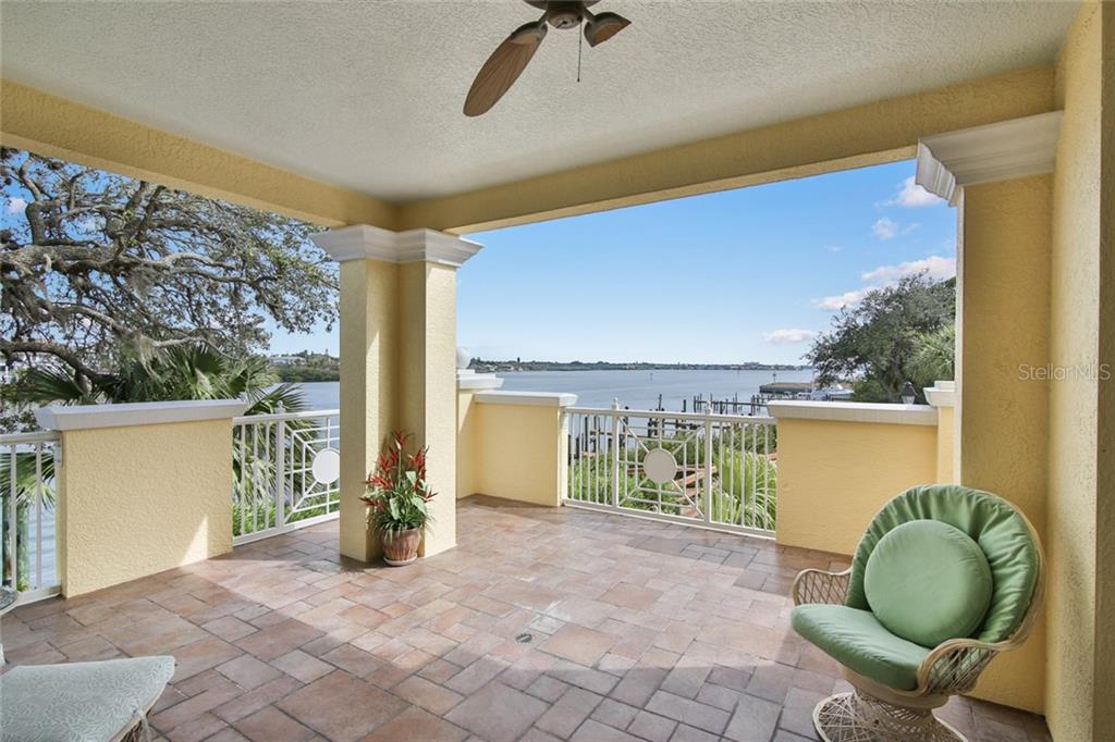 1310 Old Stickney Point Road, Unit E21 Sarasota, FL 34242 - Photo 6 of 25 Large open air terrace with beautiful long bay views