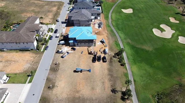 an aerial view of a house with a swimming pool