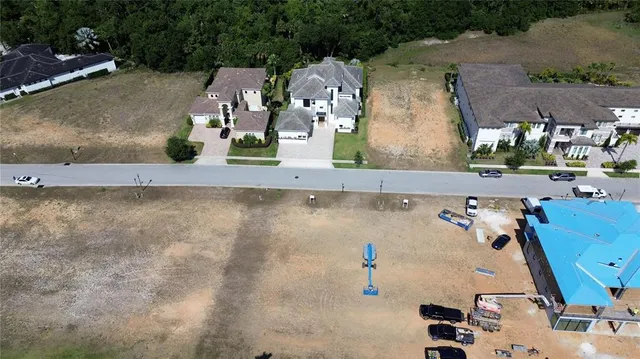 an aerial view of a house with a swimming pool