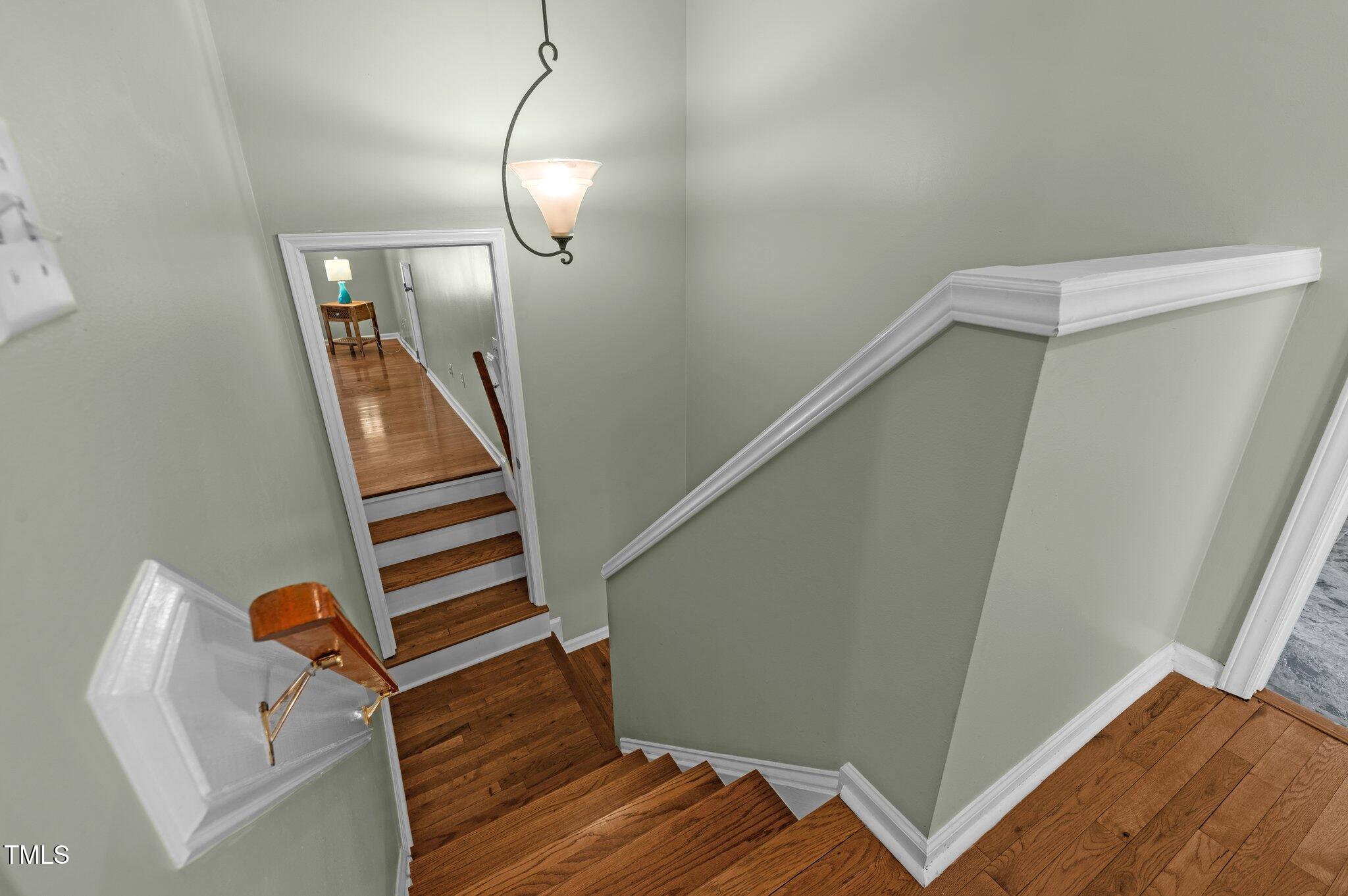 6209 Brielson Place Raleigh, NC 27616 - Photo 18 of 41 a view of entryway with wooden floor