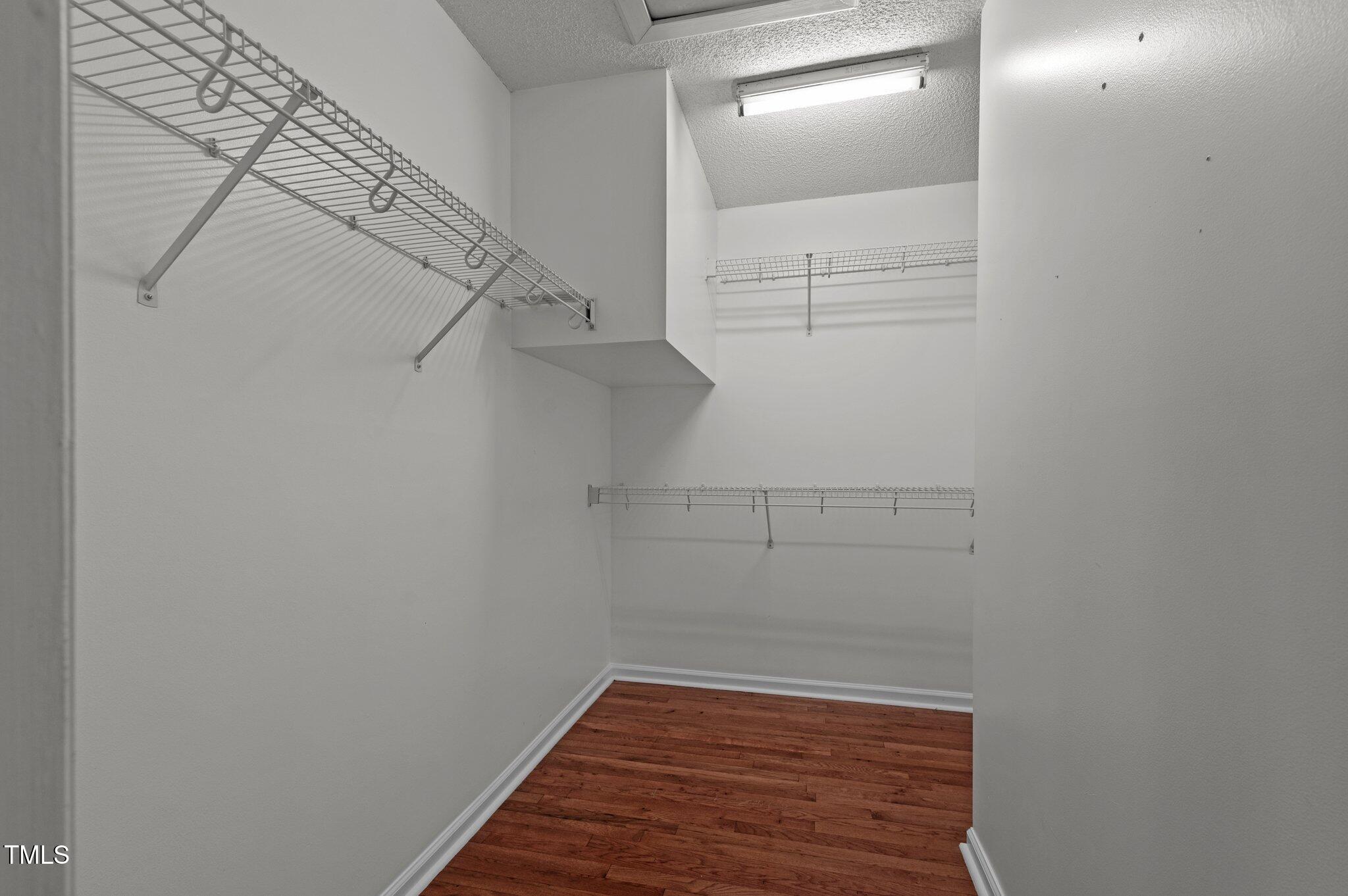 6209 Brielson Place Raleigh, NC 27616 - Photo 23 of 41 a view of a room with racks on the wall