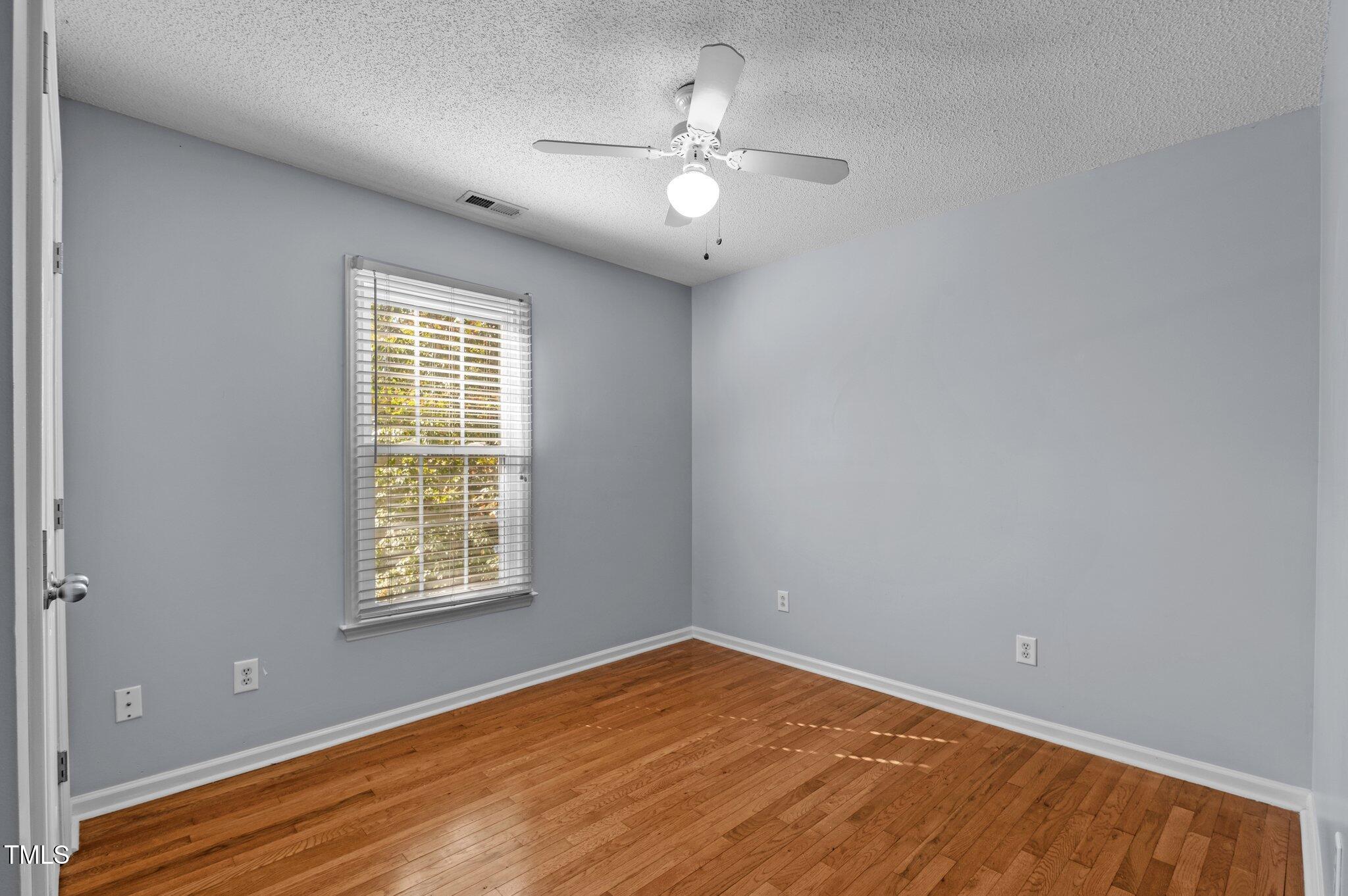 6209 Brielson Place Raleigh, NC 27616 - Photo 24 of 41 an empty room with windows and fan