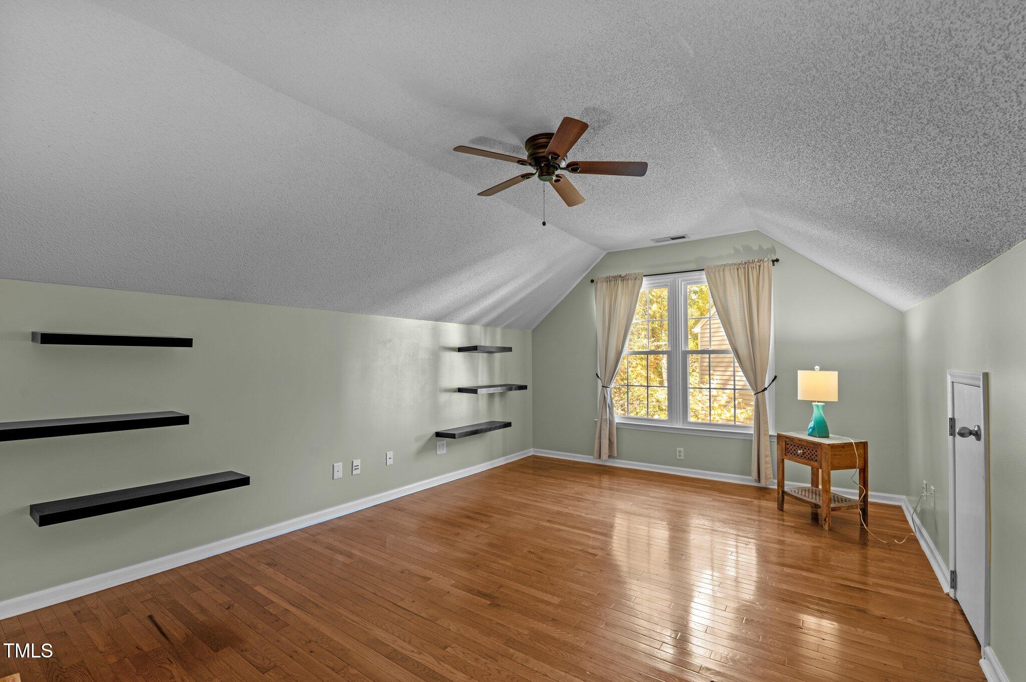 6209 Brielson Place Raleigh, NC 27616 - Photo 27 of 41 wooden floor in an empty room with a window