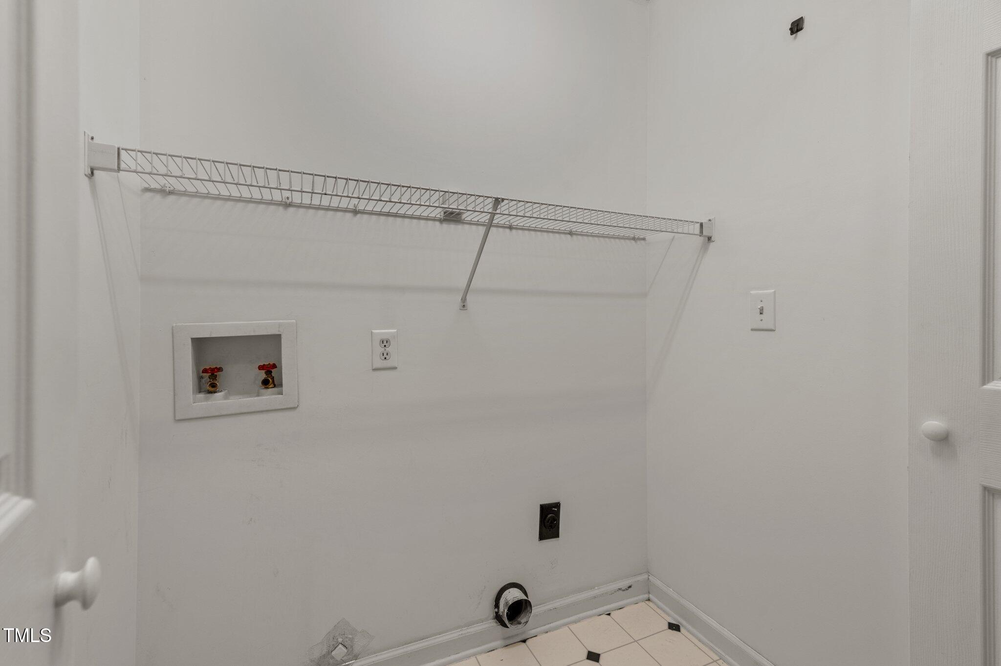 6209 Brielson Place Raleigh, NC 27616 - Photo 28 of 41 a bathroom with a shower and cabinets