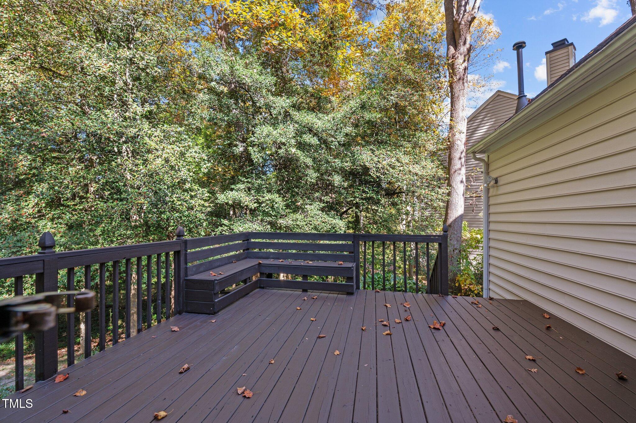 6209 Brielson Place Raleigh, NC 27616 - Photo 31 of 41 a balcony with wooden floor and outdoor seating