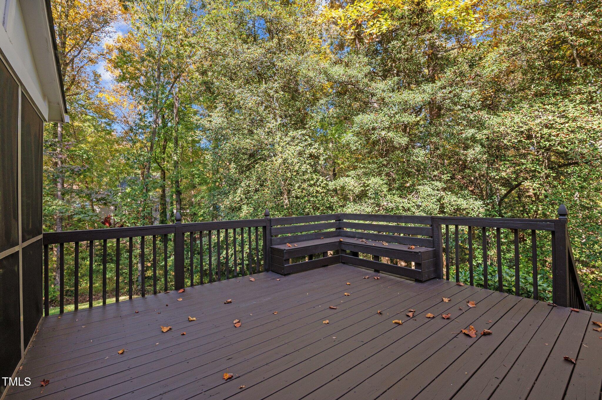 6209 Brielson Place Raleigh, NC 27616 - Photo 32 of 41 a wooden bench sitting on top of a wooden deck