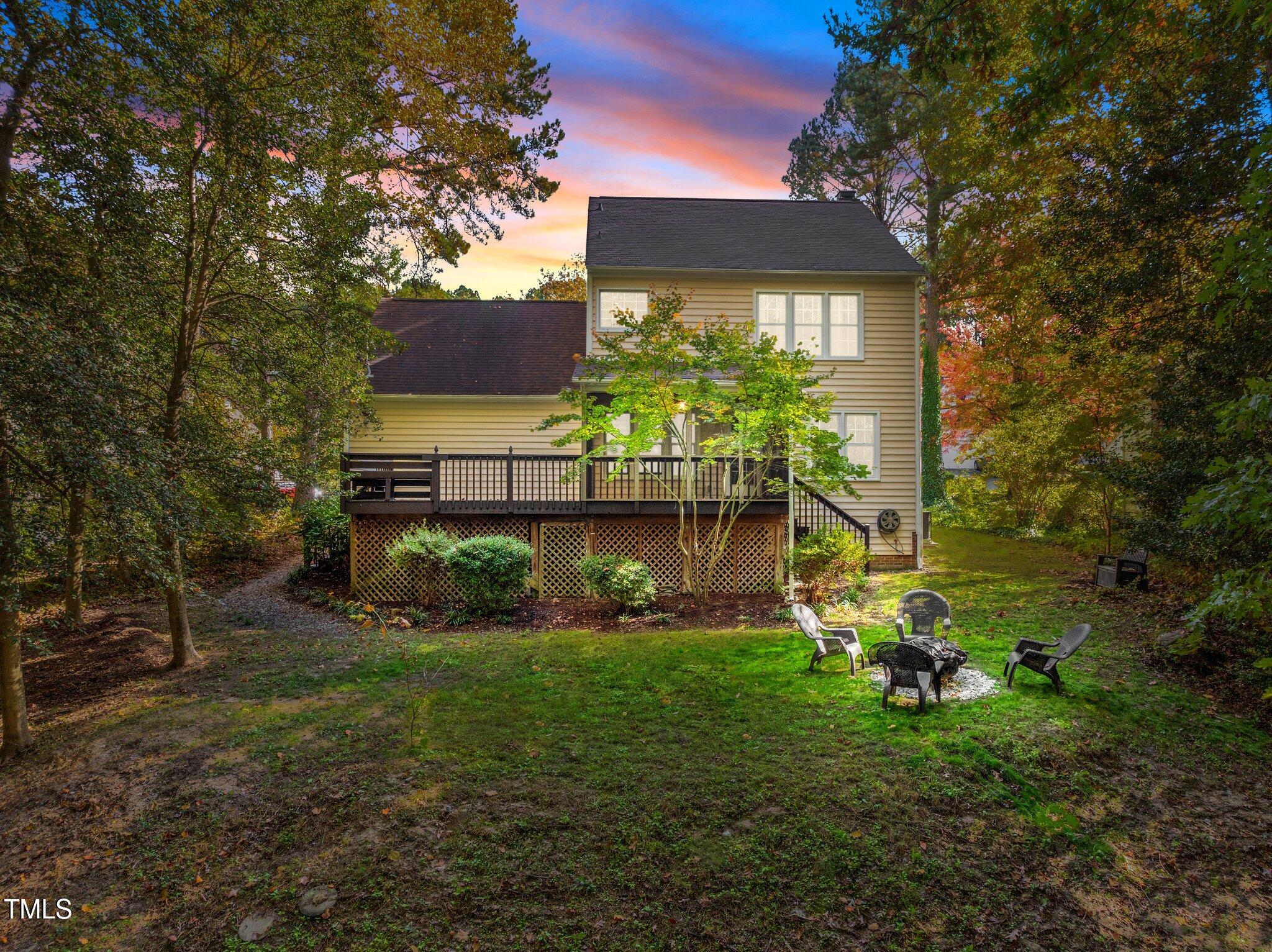 6209 Brielson Place Raleigh, NC 27616 - Photo 35 of 41 a view of a garden with a building in the background