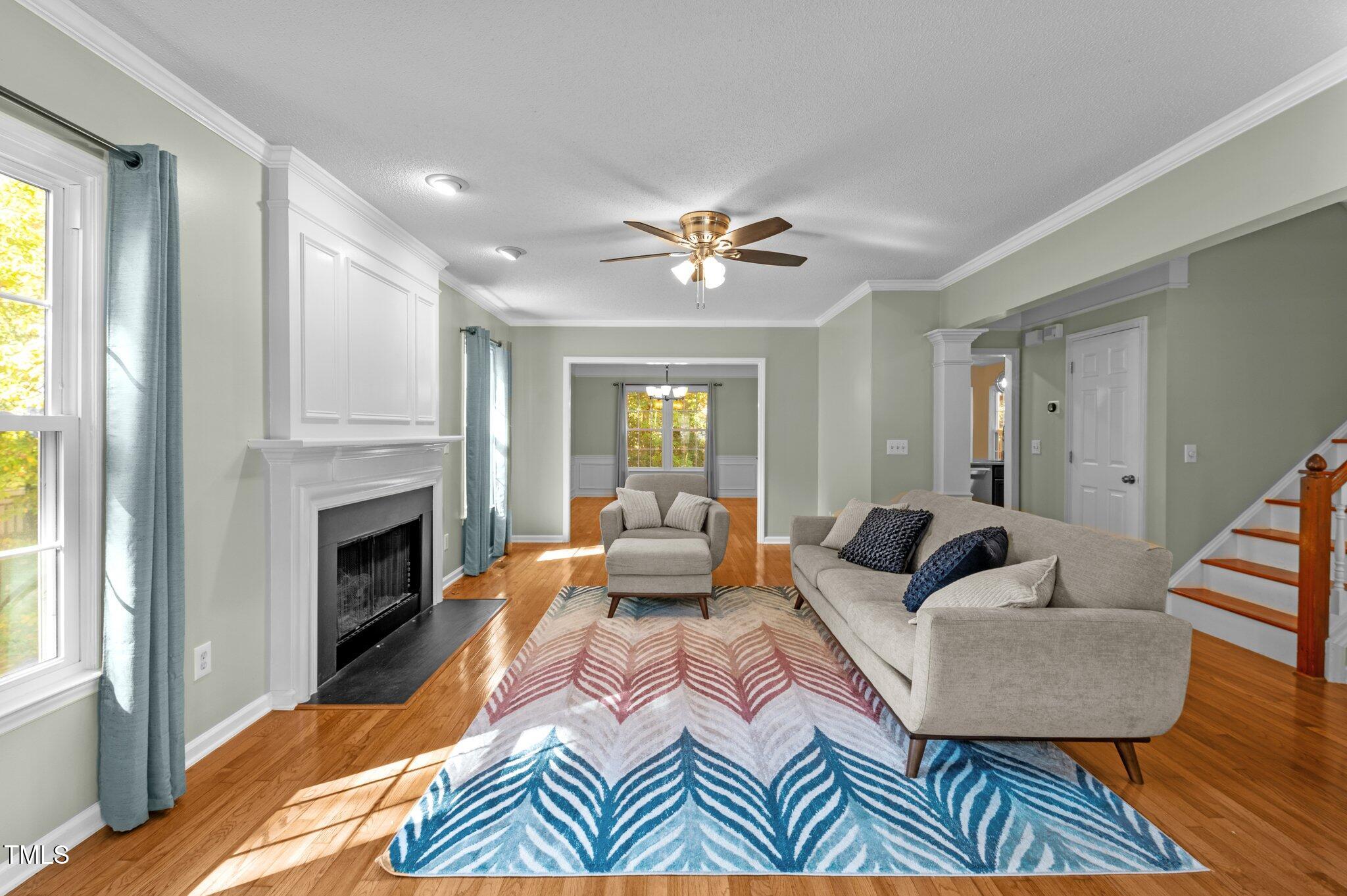6209 Brielson Place Raleigh, NC 27616 - Photo 7 of 41 a living room with furniture and a fireplace