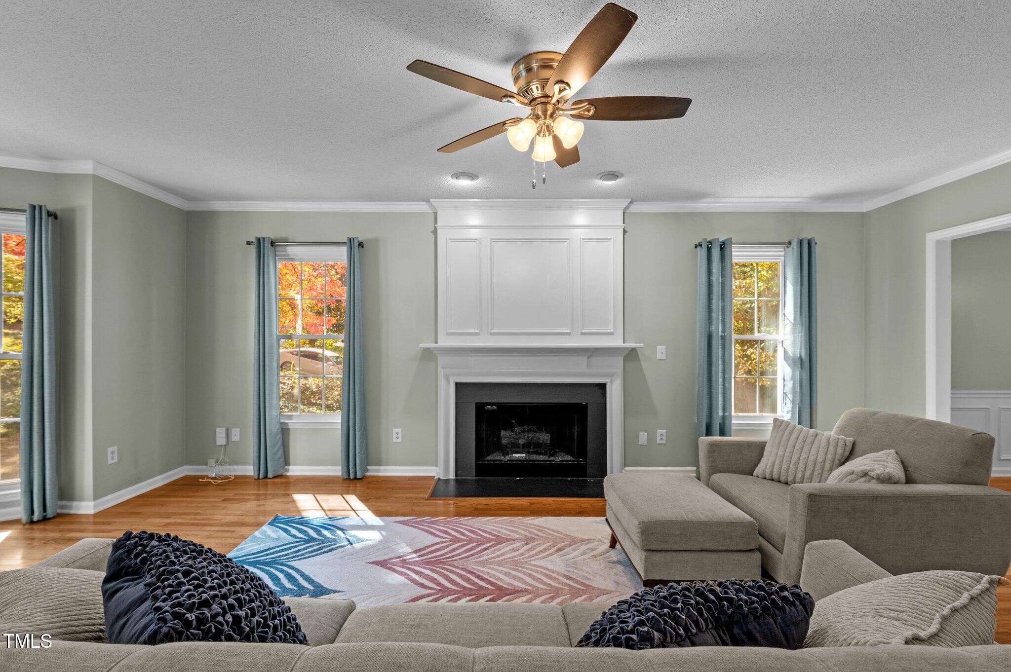 6209 Brielson Place Raleigh, NC 27616 - Photo 8 of 41 a bedroom with a bed and a fireplace