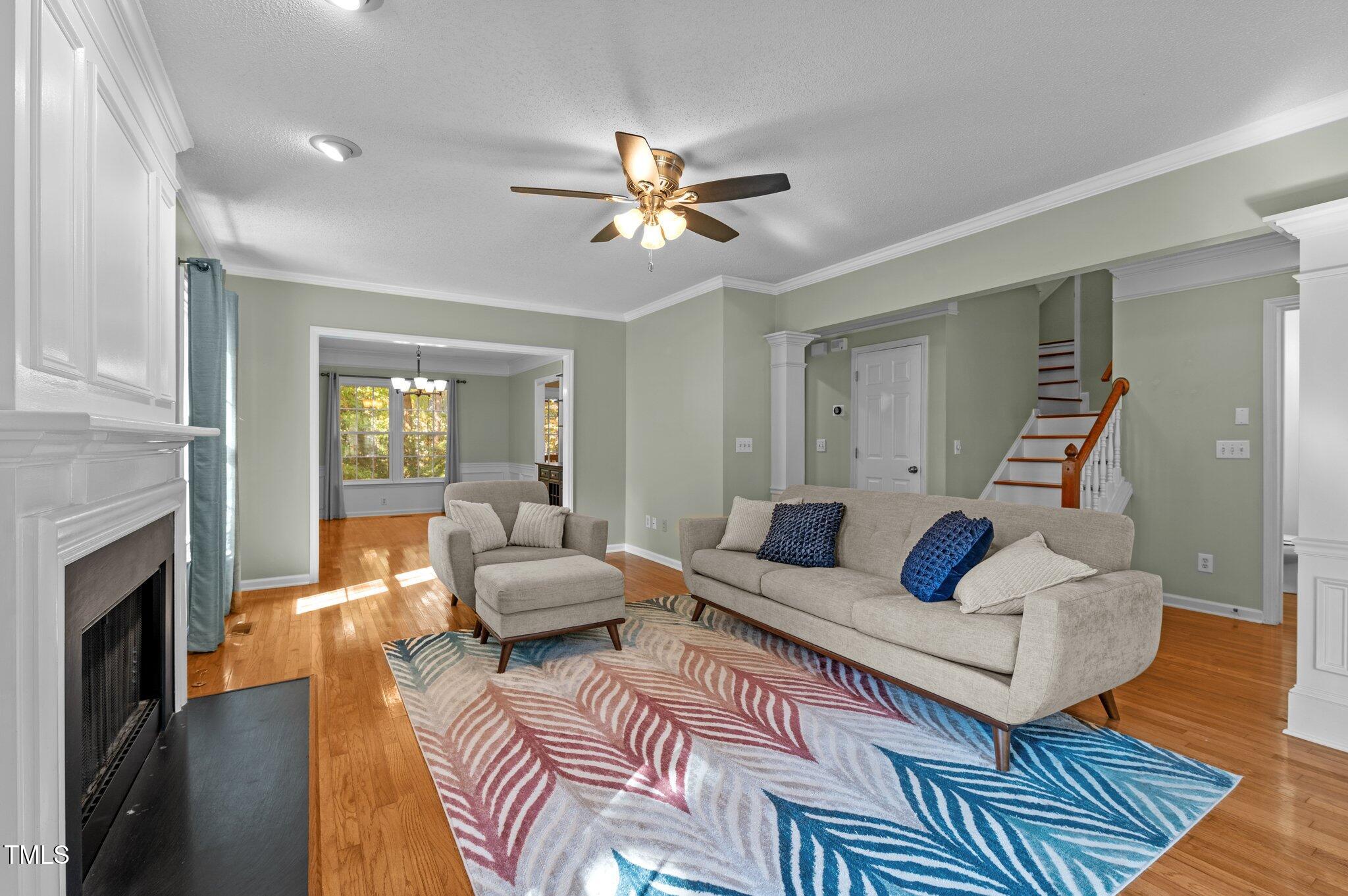 6209 Brielson Place Raleigh, NC 27616 - Photo 9 of 41 a living room with furniture and a fireplace