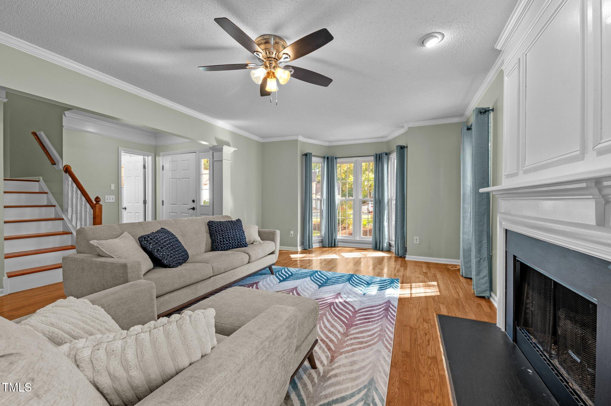 6209 Brielson Place Raleigh, NC 27616 - Photo 10 of 41 a living room with furniture and a fireplace