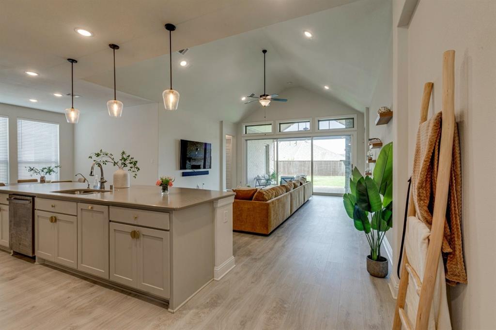 9613 Boulder Pt Road Oak Point, TX 75068 - Photo 6 of 28 Expansive kitchen island with built-in sink and pendant lighting