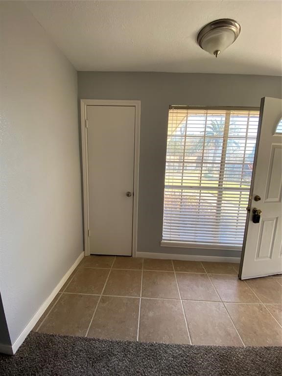 4714 Geraldine Street Pasadena, TX 77586 - Photo 2 of 11 an empty room with large windows