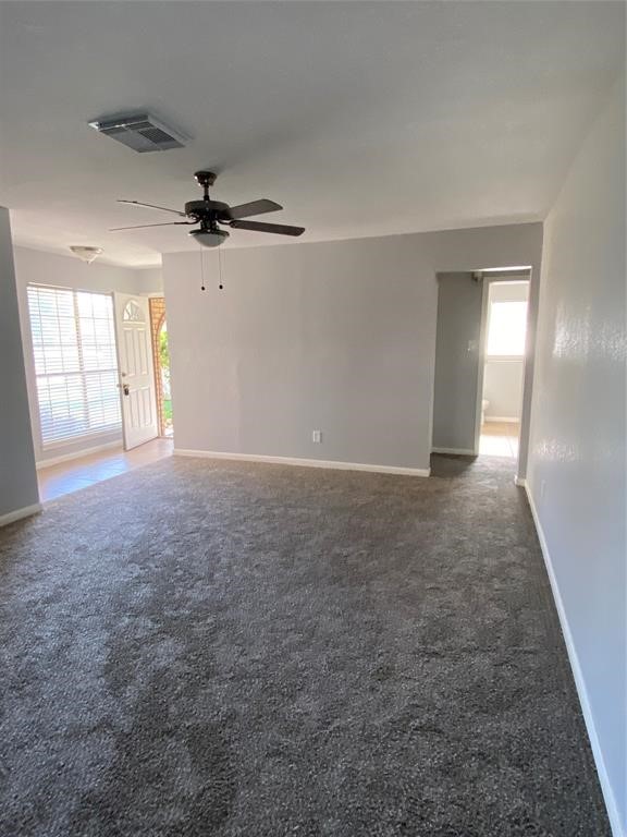 4714 Geraldine Street Pasadena, TX 77586 - Photo 3 of 11 en empty room with windows and ceiling fan