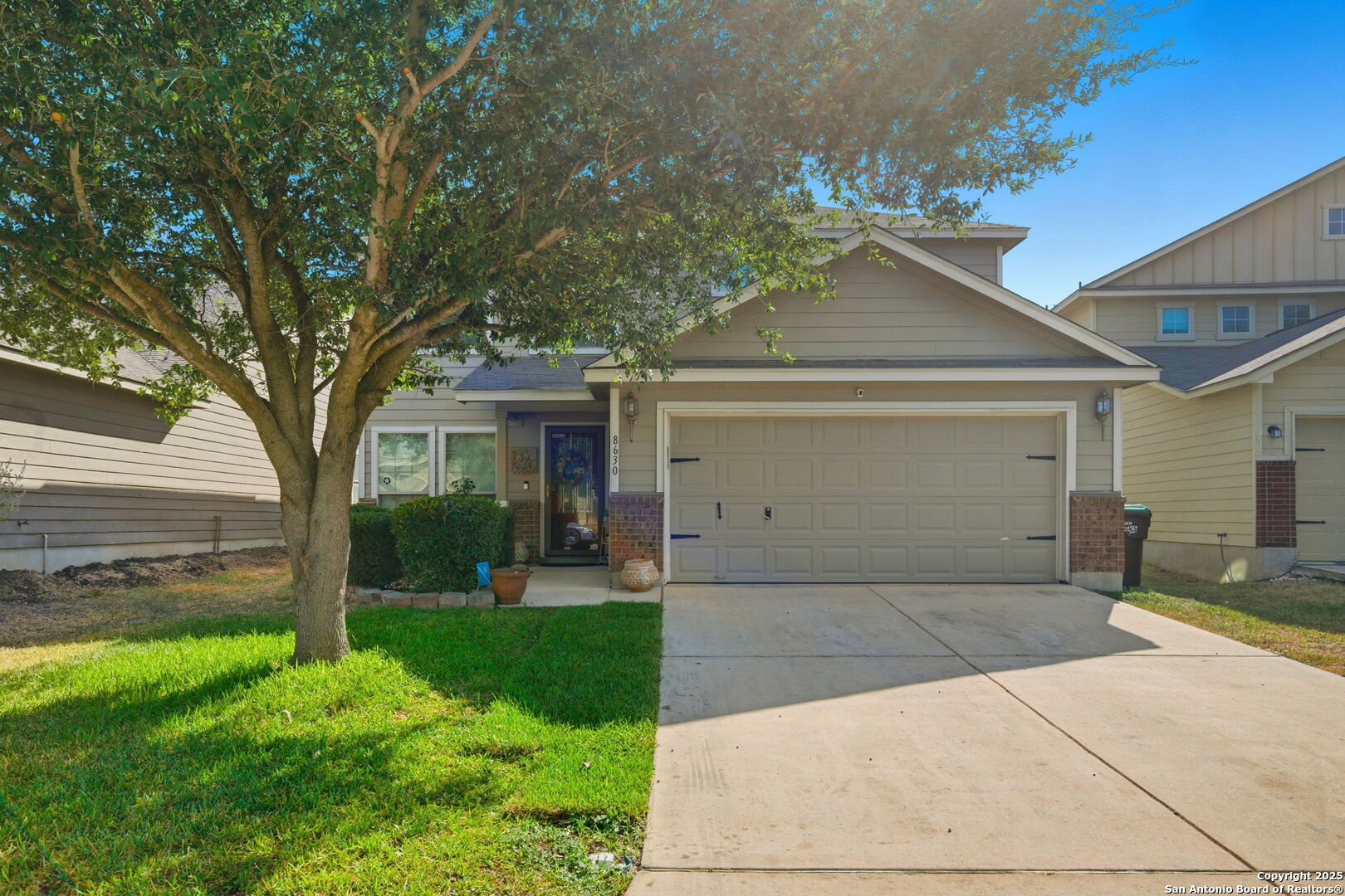front view of a house with a yard
