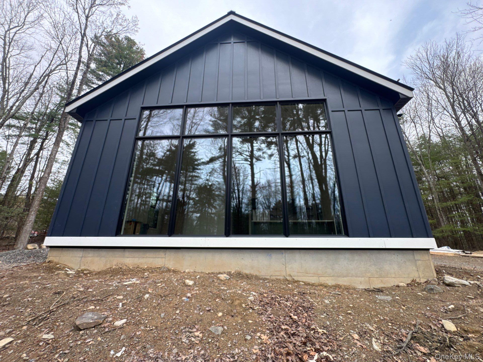 720 Upper Cherrytown Road Kerhonkson, NY 12446 - Photo 3 of 6 a view of small house with a small yard