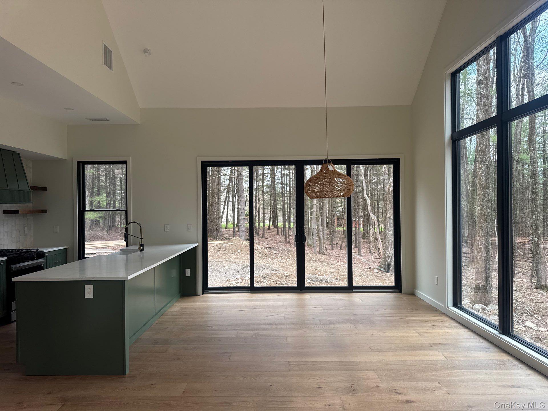 720 Upper Cherrytown Road Kerhonkson, NY 12446 - Photo 4 of 6 a view of an empty room with a window