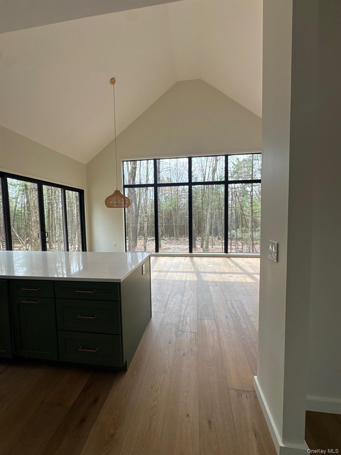 720 Upper Cherrytown Road Kerhonkson, NY 12446 - Photo 5 of 6 wooden floor in an empty room with a window
