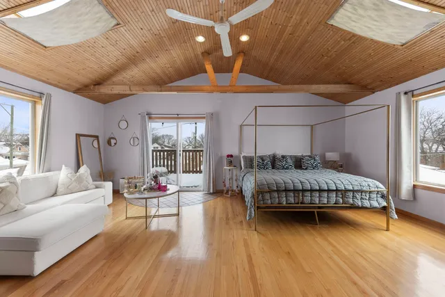 a bedroom with a bed and a couch