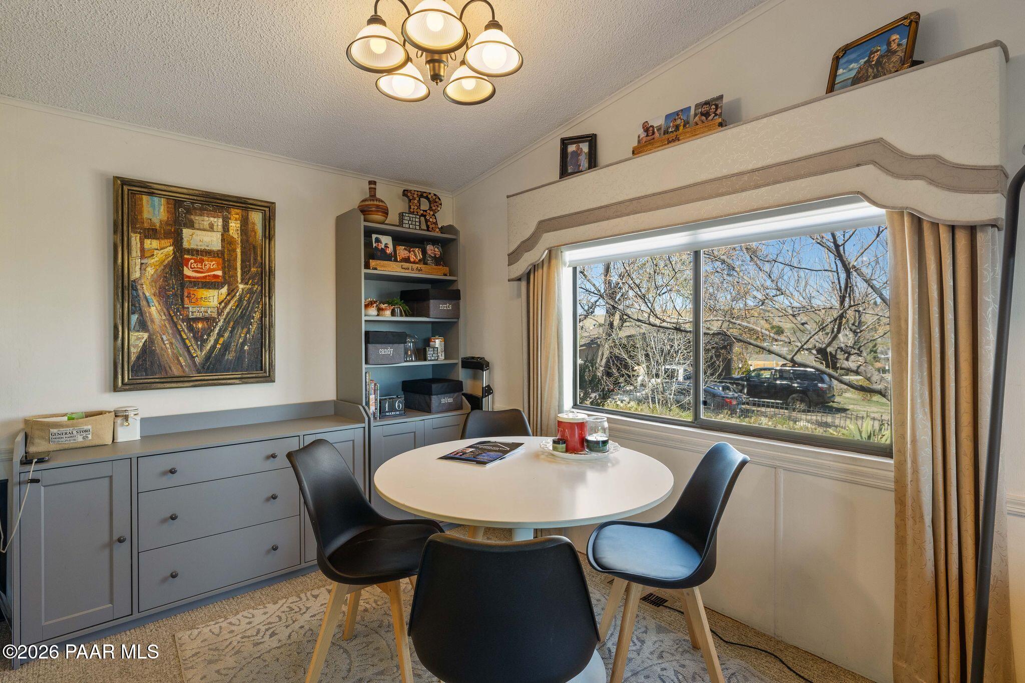 10194 East Durham Road Dewey, AZ 86327 - Photo 13 of 47 a view of a dining room with furniture window and outside view