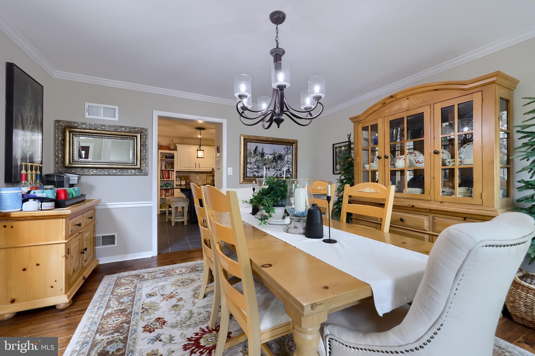 315 Royal Hunt Way Lititz, PA 17543 - Photo 11 of 67 a living room with furniture a dining table and a flat screen tv