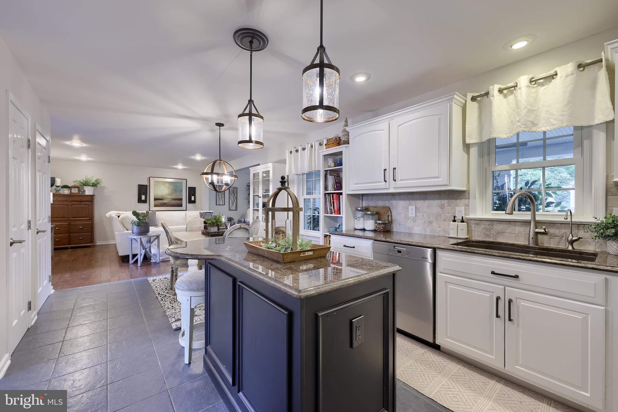 315 Royal Hunt Way Lititz, PA 17543 - Photo 15 of 67 a kitchen with kitchen island granite countertop a sink a counter top space appliances and cabinets