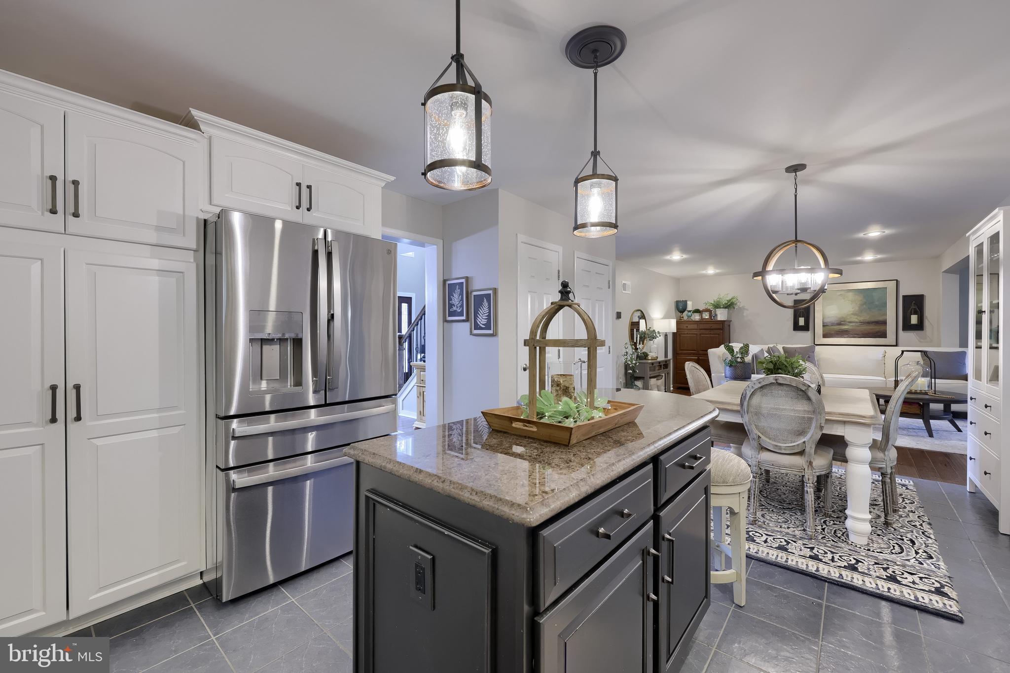 315 Royal Hunt Way Lititz, PA 17543 - Photo 16 of 67 a kitchen with stainless steel appliances granite countertop a sink a stove and a refrigerator