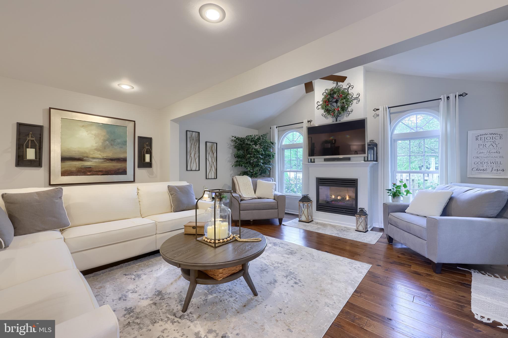 315 Royal Hunt Way Lititz, PA 17543 - Photo 26 of 67 a living room with furniture a flat screen tv and a fireplace