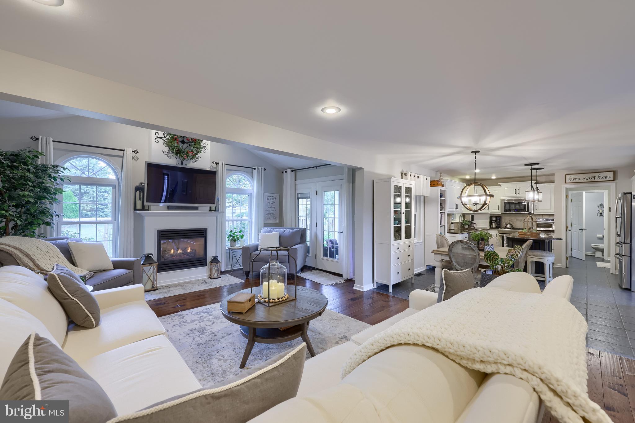 315 Royal Hunt Way Lititz, PA 17543 - Photo 27 of 67 a living room with furniture kitchen view and a fireplace