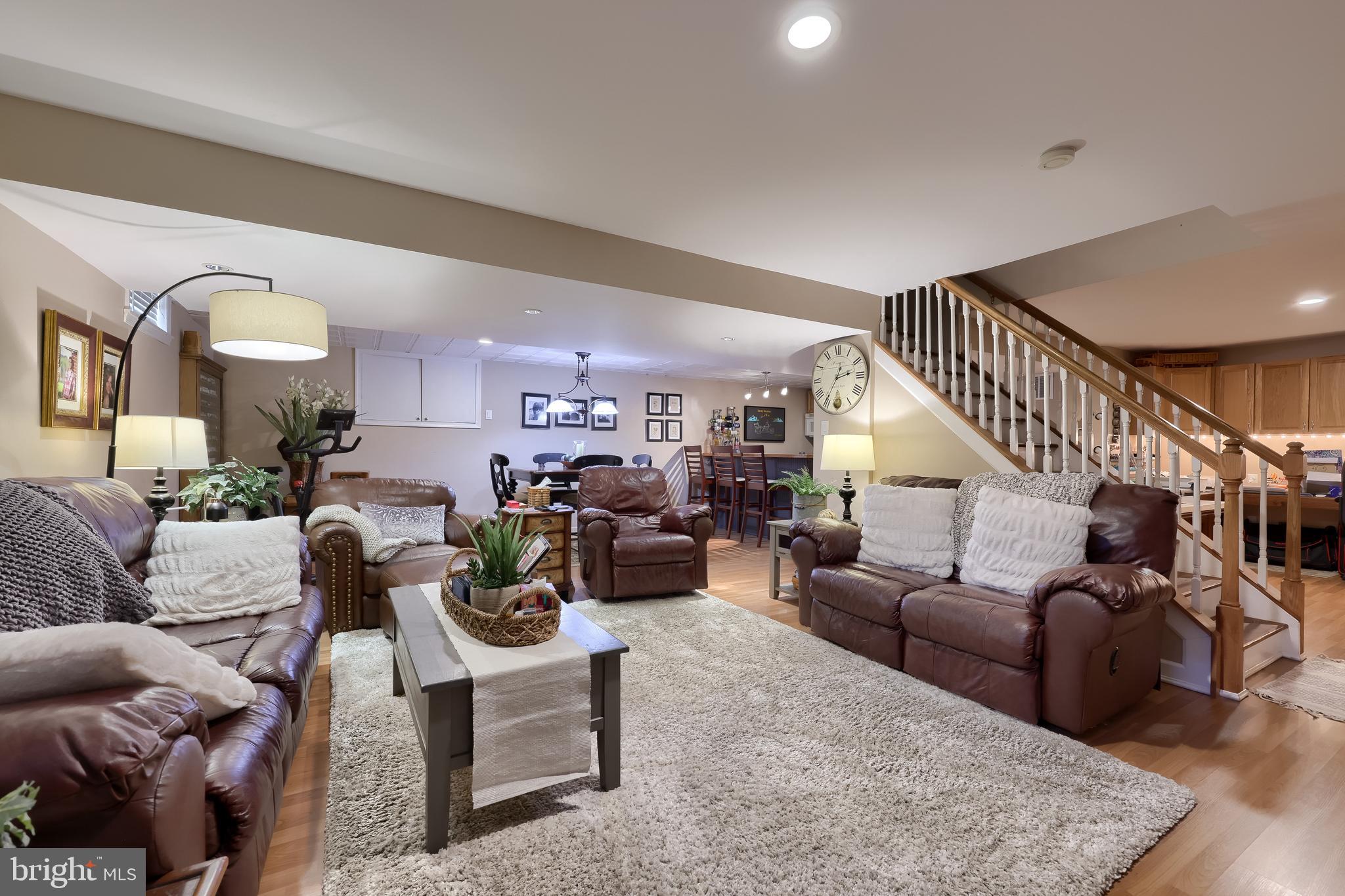 315 Royal Hunt Way Lititz, PA 17543 - Photo 53 of 67 a living room with furniture kitchen view and a wooden floor