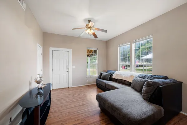 a living room with furniture and a window