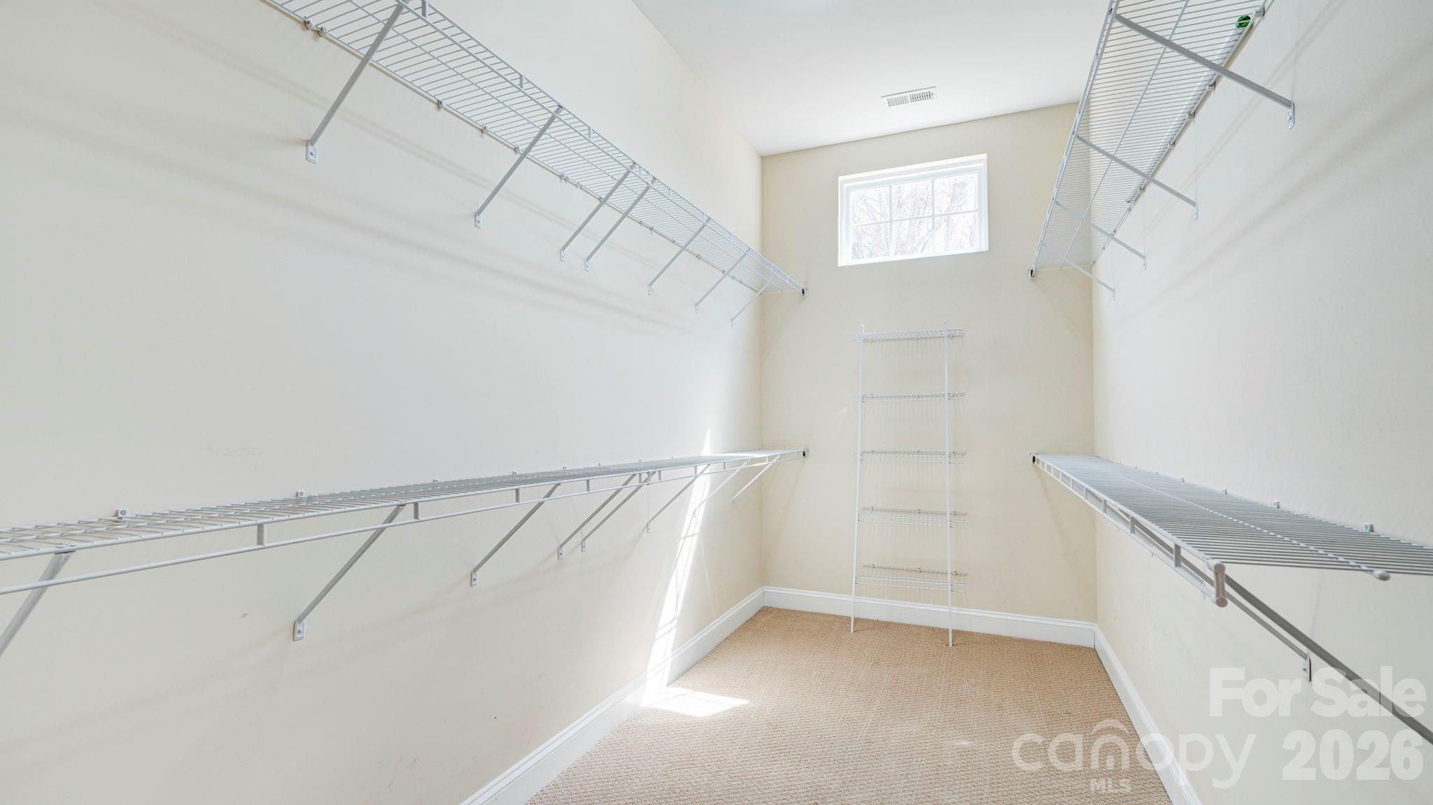 1162 Gold Rush Court Fort Mill, SC 29708 - Photo 14 of 21 a view of walk in closet with empty racks