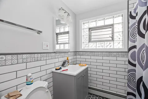 a bathroom with a sink and a shower