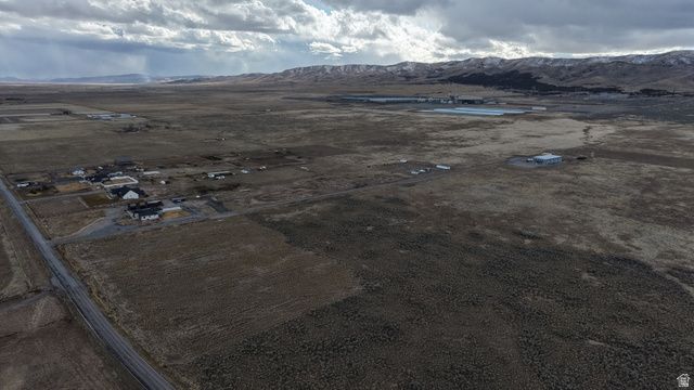 1065 Goshen Canyon Road, Unit 2 Mona, UT 84645 - Photo 15 of 21 Aerial view of sparsely populated area featuring a mountainous background and a desert landscape