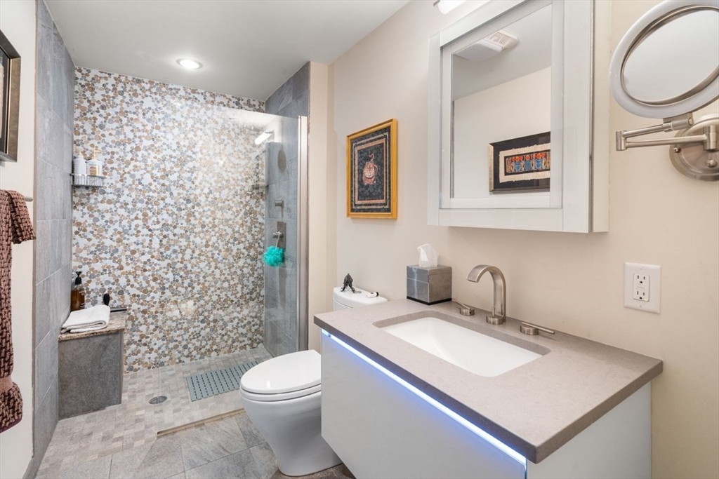 241 Perkins Street, Unit C306 Boston, MA 02130 - Photo 13 of 33 a bathroom with a sink toilet and shower