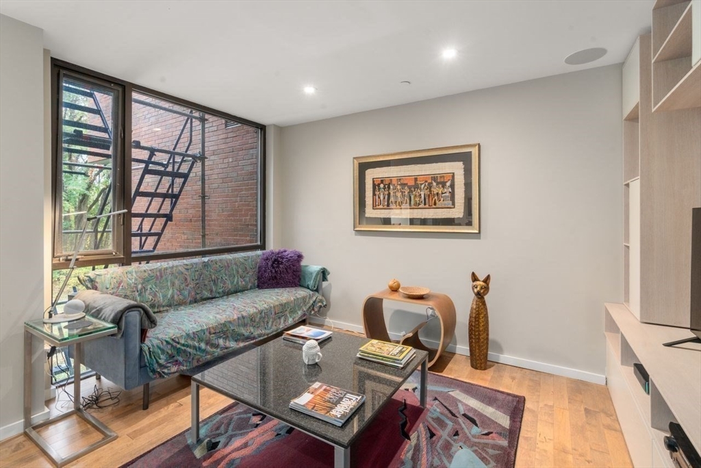 241 Perkins Street, Unit C306 Boston, MA 02130 - Photo 14 of 33 a living room with furniture and a window
