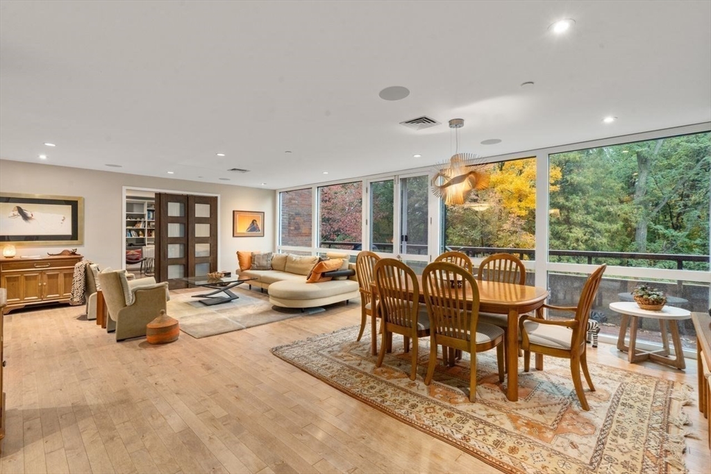 241 Perkins Street, Unit C306 Boston, MA 02130 - Photo 2 of 33 a dining room with furniture and a large window