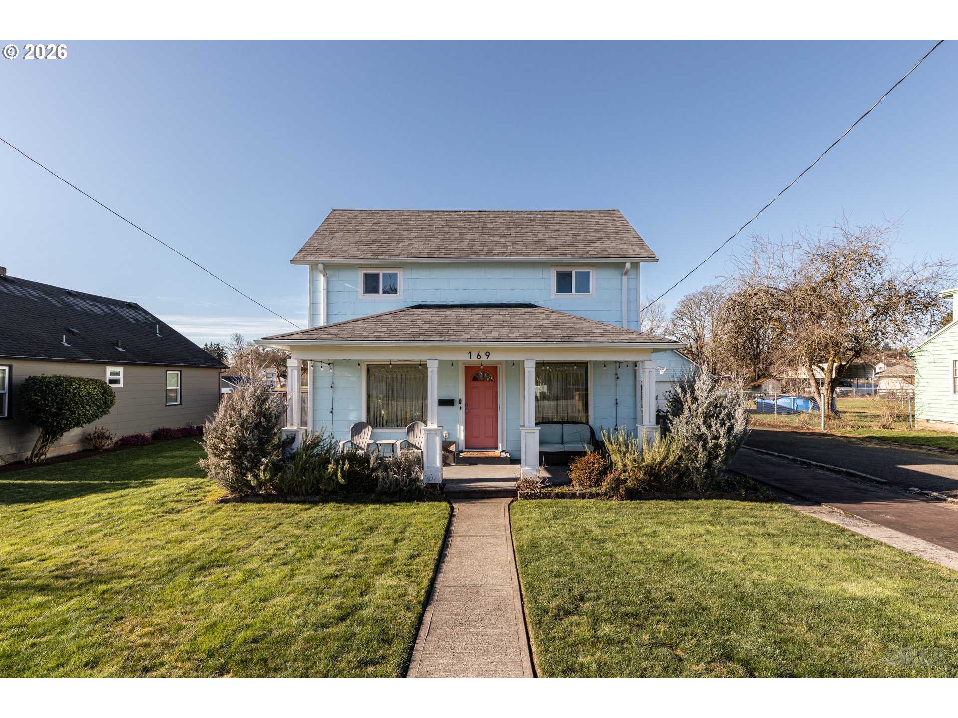 a front view of a house with a yard table and chairs