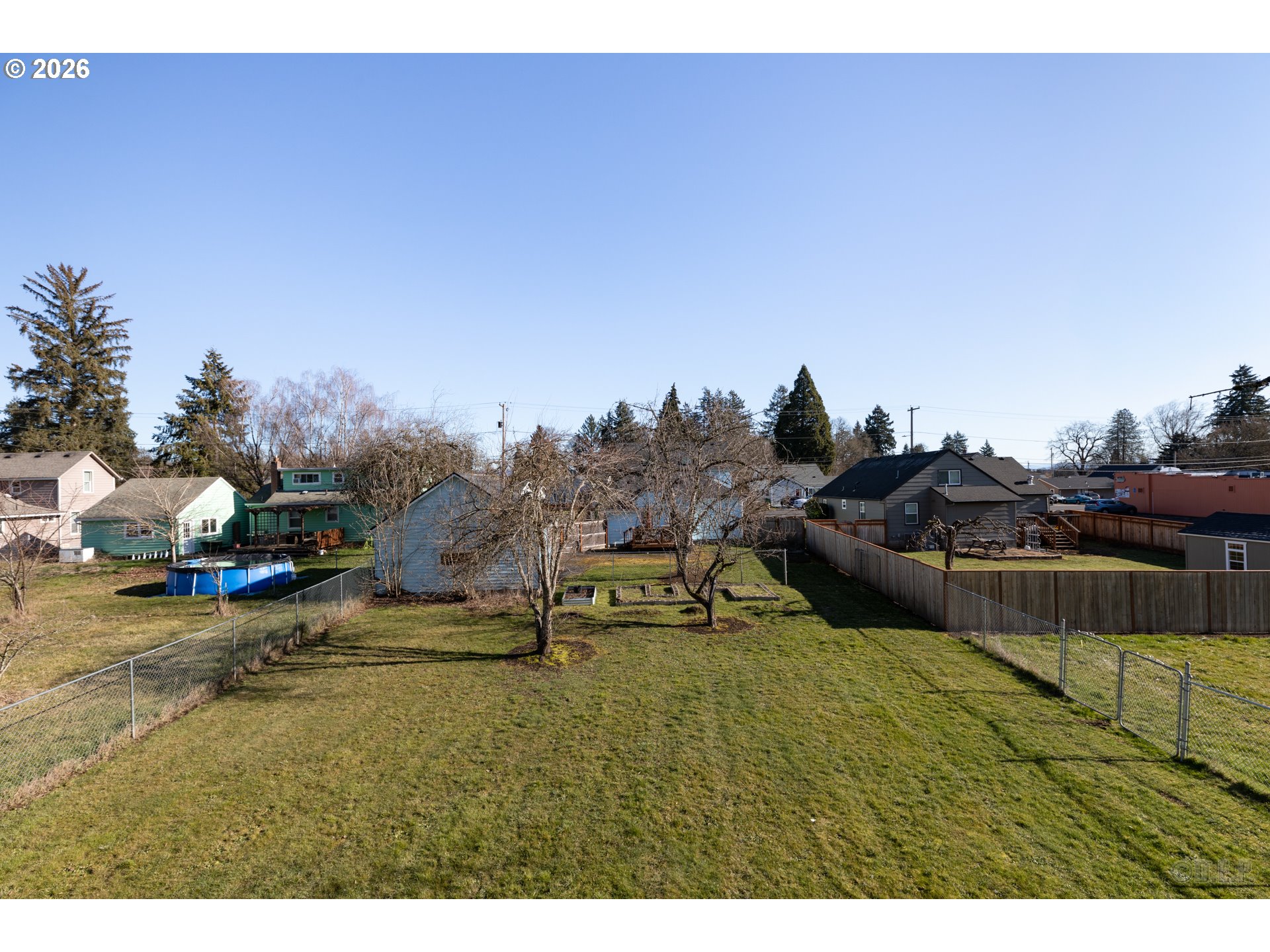 169 North Vernonia Road St. Helens, OR 97051 - Photo 23 of 27 a view of swimming pool with outdoor seating and trees in the background