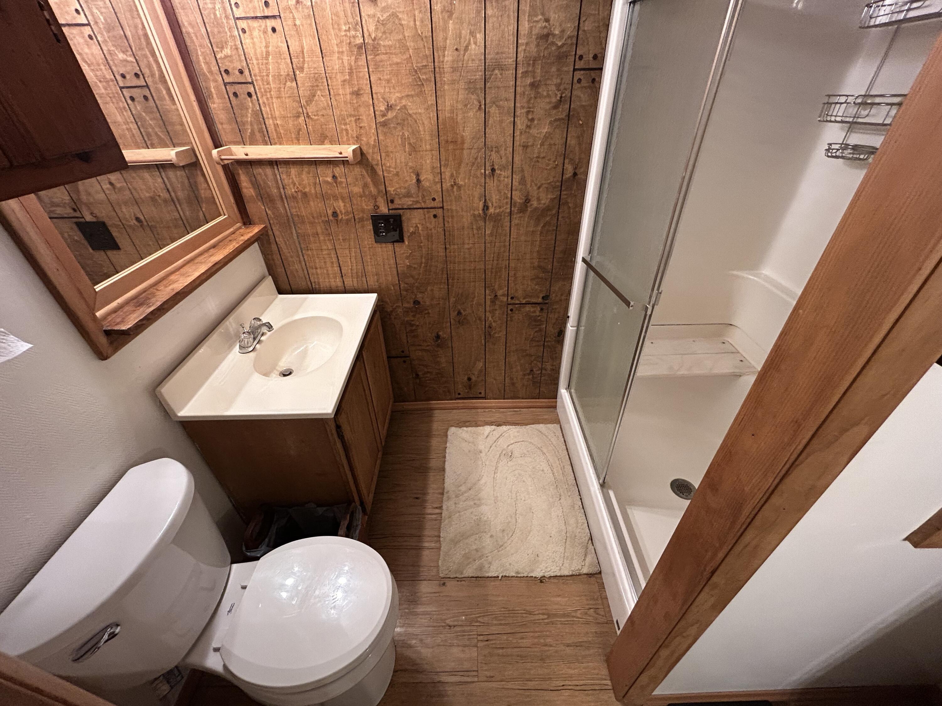 308 Spring Hollow Road Troutville, VA 24175 - Photo 12 of 24 a bathroom with a toilet mirror and vanity